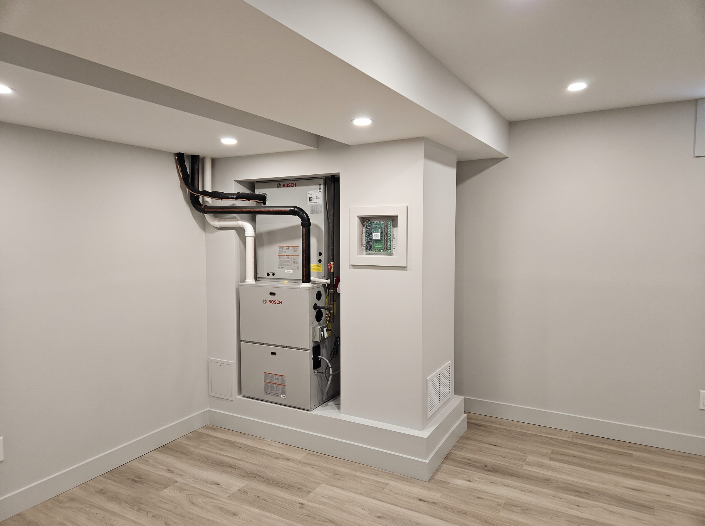 Bosch high-efficiency furnace installed in a finished basement by LaCroix Heating and Cooling